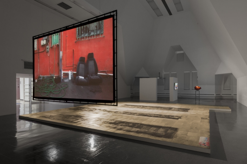 A close-up of cardboard on dirty glass, the word