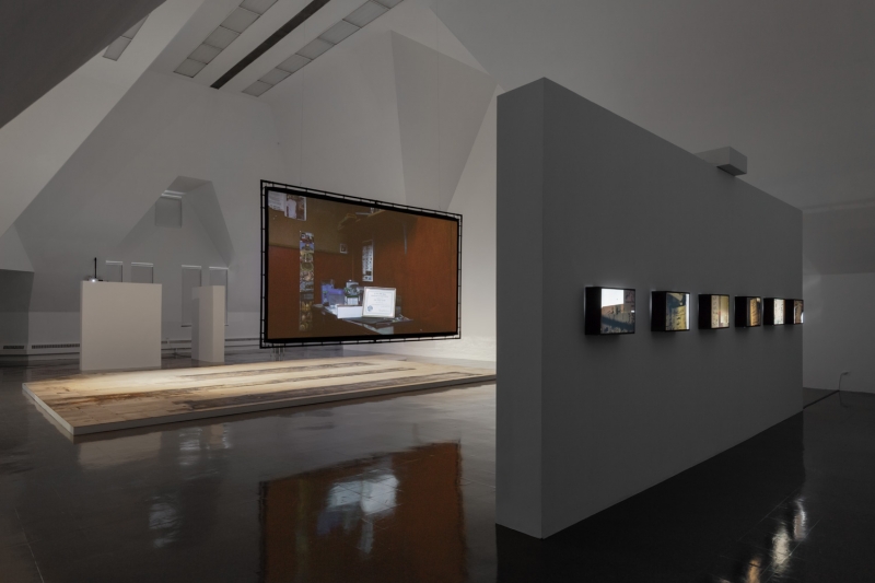 A close-up of cardboard on dirty glass, the word