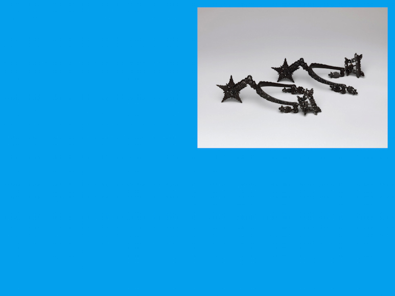 A photo of two small sculptures inside a deep sky blue rectangle